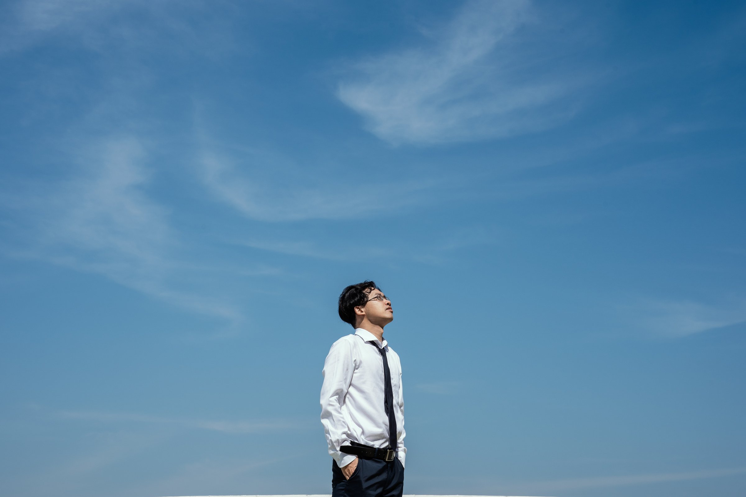 Man Looking Up at the Sky